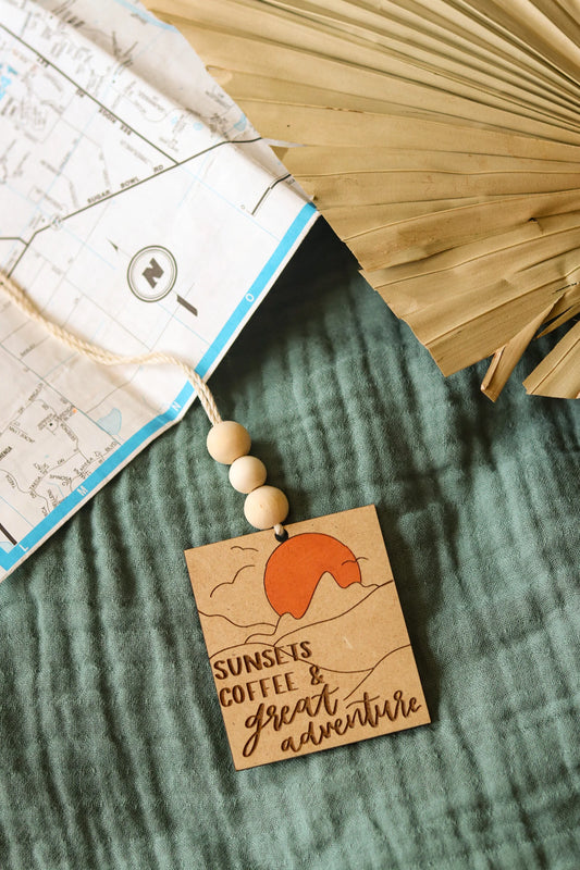 'Sunsets, Coffee and Great Adventure' Car Charm